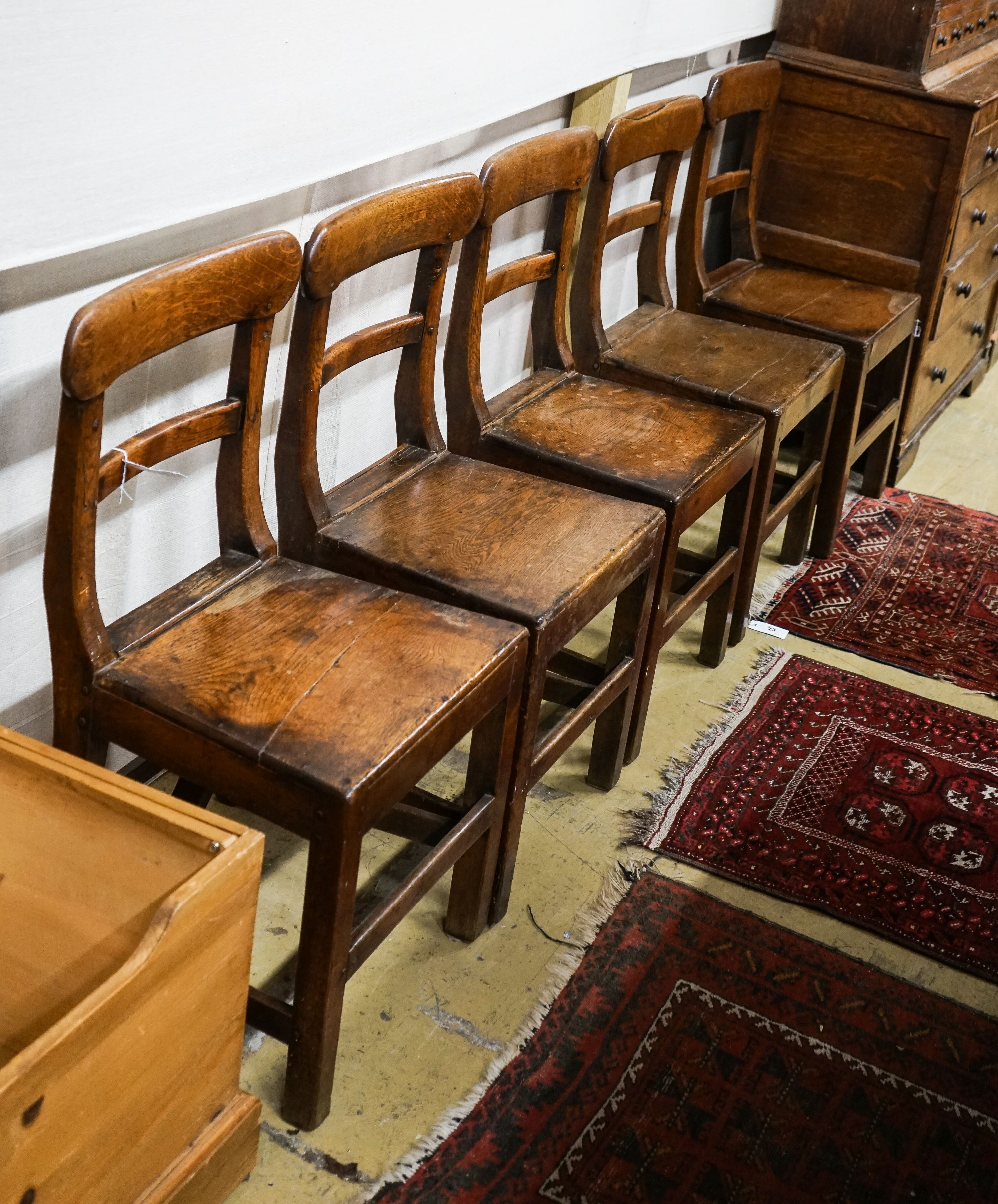 A set of five early 19th century Welsh provincial oak dining chairs